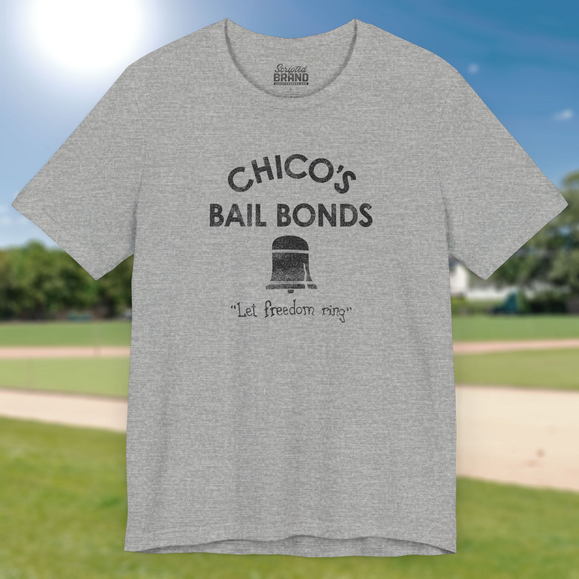Front view of grey t-shirt with distressed Chico’s Bail Bonds logo and “Let freedom ring” slogan from The Bad News Bears movie.