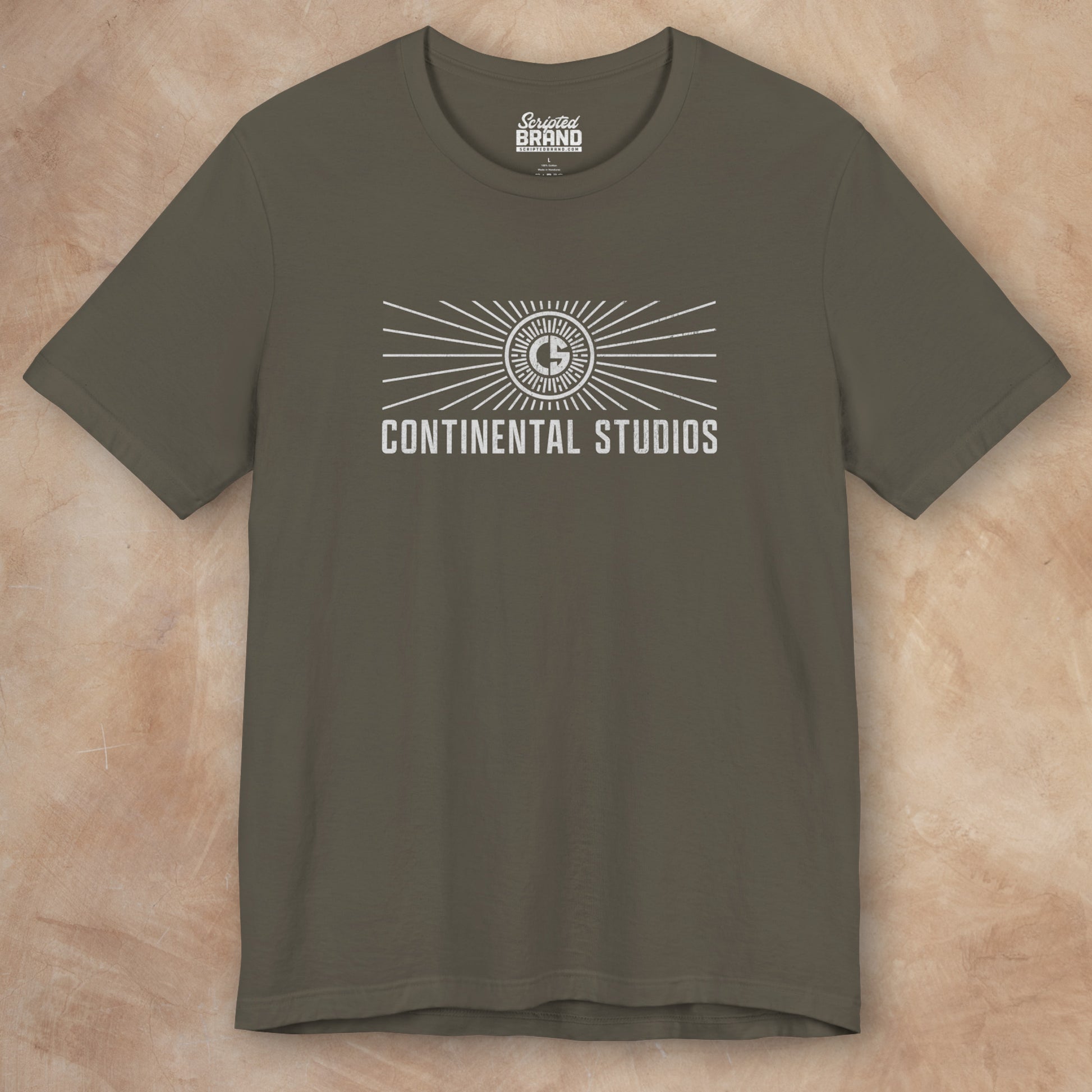Front view of an army green colored Soft Bella+Canvas 3001 short-sleeve t-shirt featuring the logo graphic of the fictional movie studio Continental Studios inspired by the Apple TV show The Studio in a vintage distressed style, sold by ScriptedBrand.