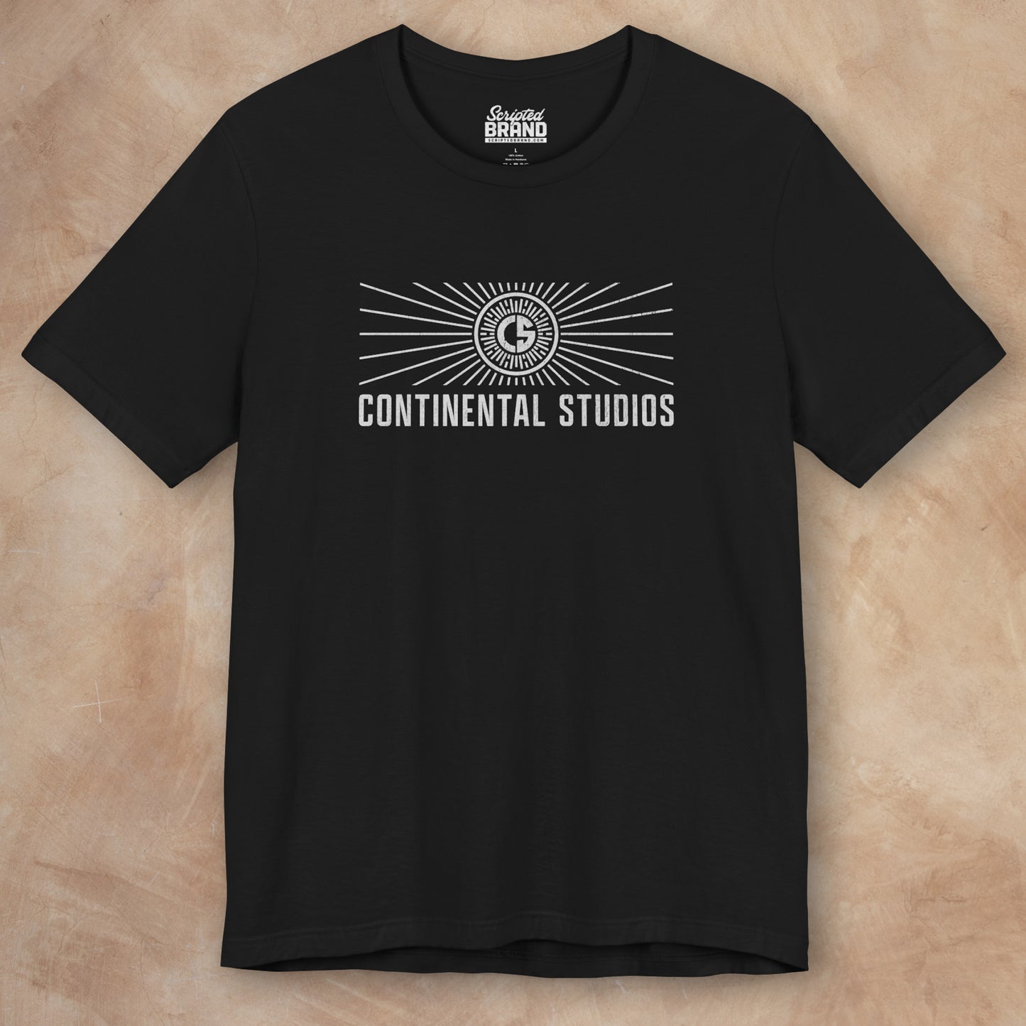 Front view of a black colored Soft Bella+Canvas 3001 short-sleeve t-shirt featuring the logo graphic of the fictional movie studio Continental Studios inspired by the Apple TV show The Studio in a vintage distressed style, sold by ScriptedBrand.