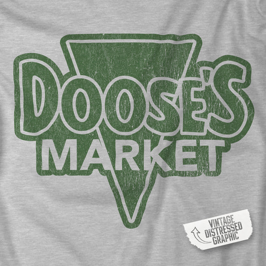 Closeup of Grey Bella+Canvas t-shirt with a vintage-style Doose’s Market logo graphic in green, inspired by Gilmore Girls