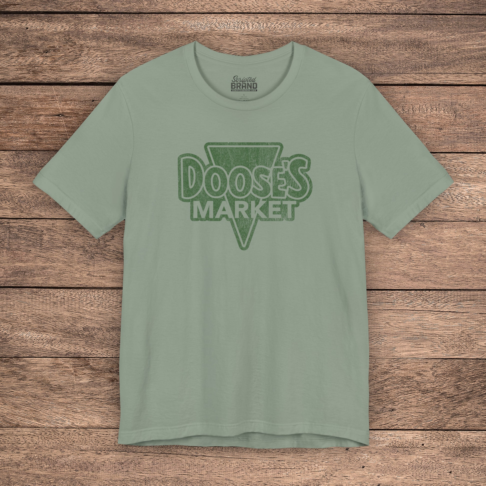 Sage green Bella+Canvas t-shirt with a vintage-style Doose’s Market logo graphic, inspired by Gilmore Girls