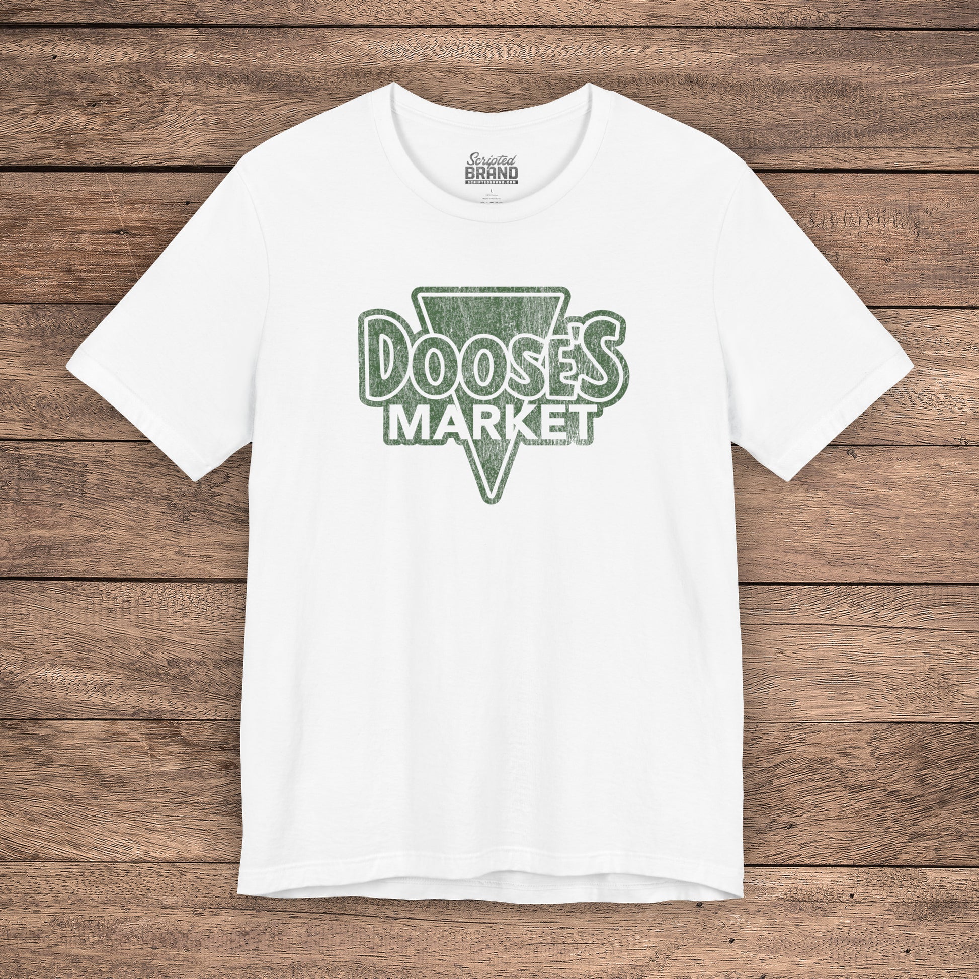 White Bella+Canvas t-shirt with a vintage-style Doose’s Market logo graphic in green, inspired by Gilmore Girls