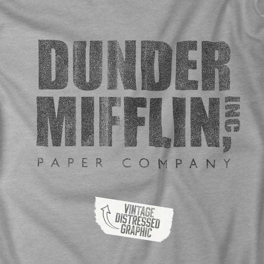 Closeup of Heather Gray t-shirt featuring the Dunder Mifflin logo from the TV show The Office in a vintage distressed style.
