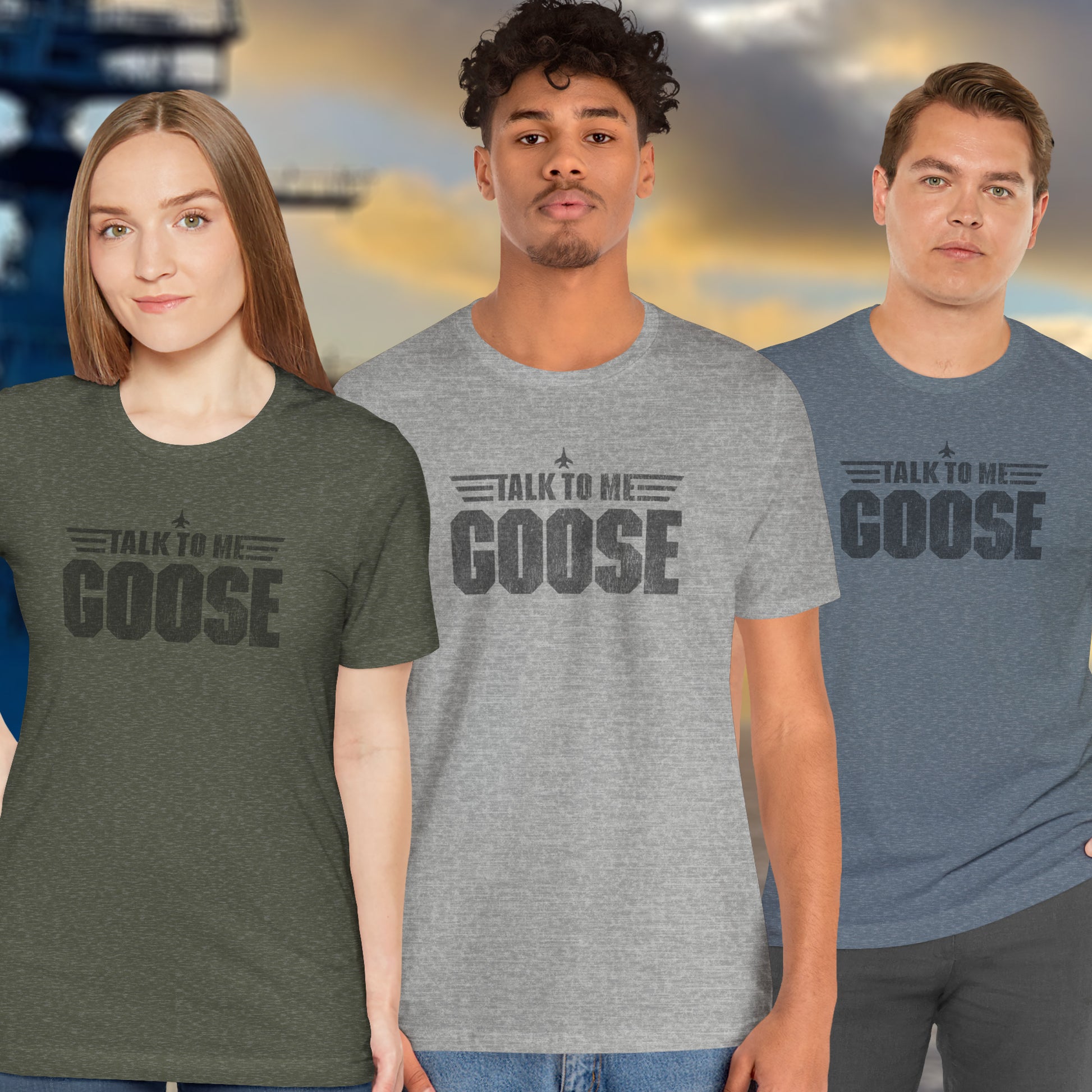 3 models wearing soft unisex Bella+Canvas 3001 short-sleeve t-shirts featuring a graphic designed by ScriptedBrand in a vintage distressed style with the text TALK TO ME GOOSE, inspired by the Movie Top Gun.