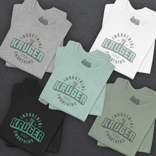 Group of 5 folded Soft unisex Bella+Canvas 3001 short-sleeve t-shirts featuring a Kruger Industrial Smoothing logo graphic in a vintage distressed style, designed by ScriptedBrand, and  inspired by the TV show Seinfeld.