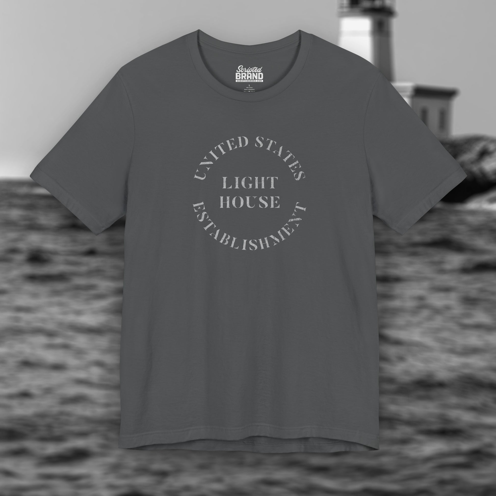 Asphalt Gray t-shirt featuring the United States Light House Establishment logo graphic worn by Robert Pattinson in the movie The Lighthouse in a vintage distressed style.