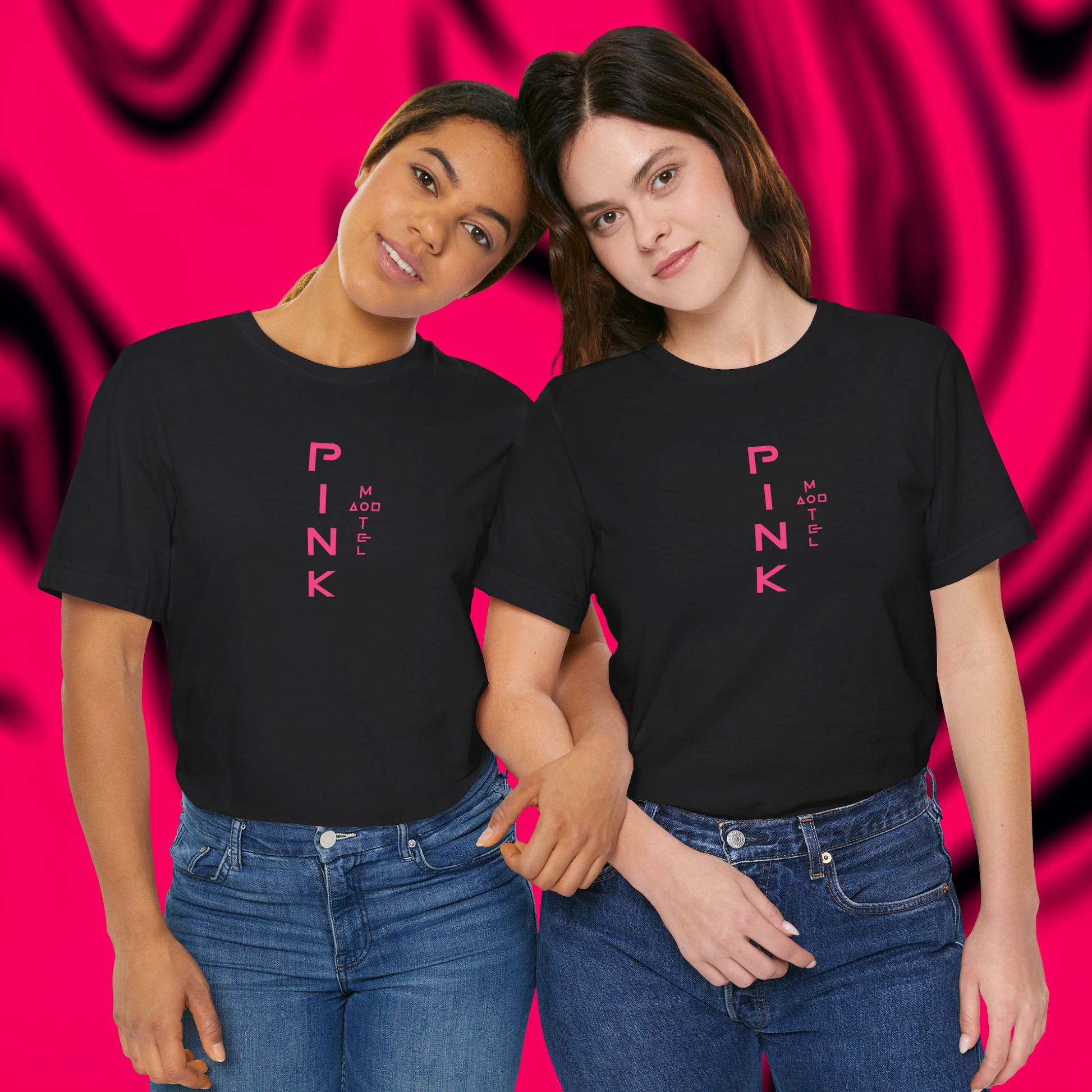 Front view of 2 female models wearing black colored soft Bella+Canvas 3001 short-sleeve t-shirts featuring a pink logo graphic of the fictional Pink Motel inspired by the TV series Squid Game, in a vintage distressed style, sold by ScriptedBrand.
