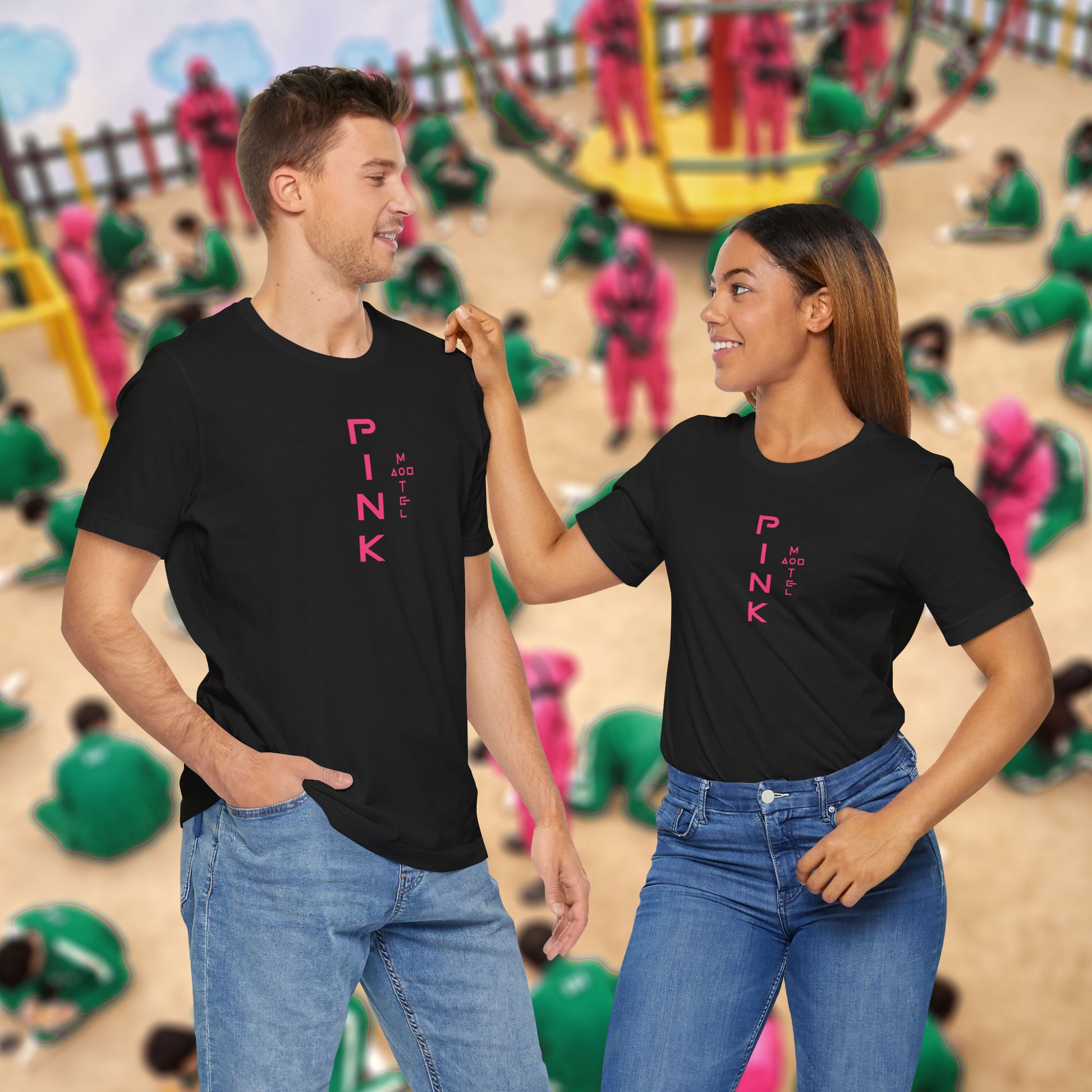 2 models wearing a black colored soft Bella+Canvas 3001 short-sleeve t-shirts featuring a pink logo graphic of the fictional Pink Motel inspired by the TV series Squid Game, in a vintage distressed style, sold by ScriptedBrand.