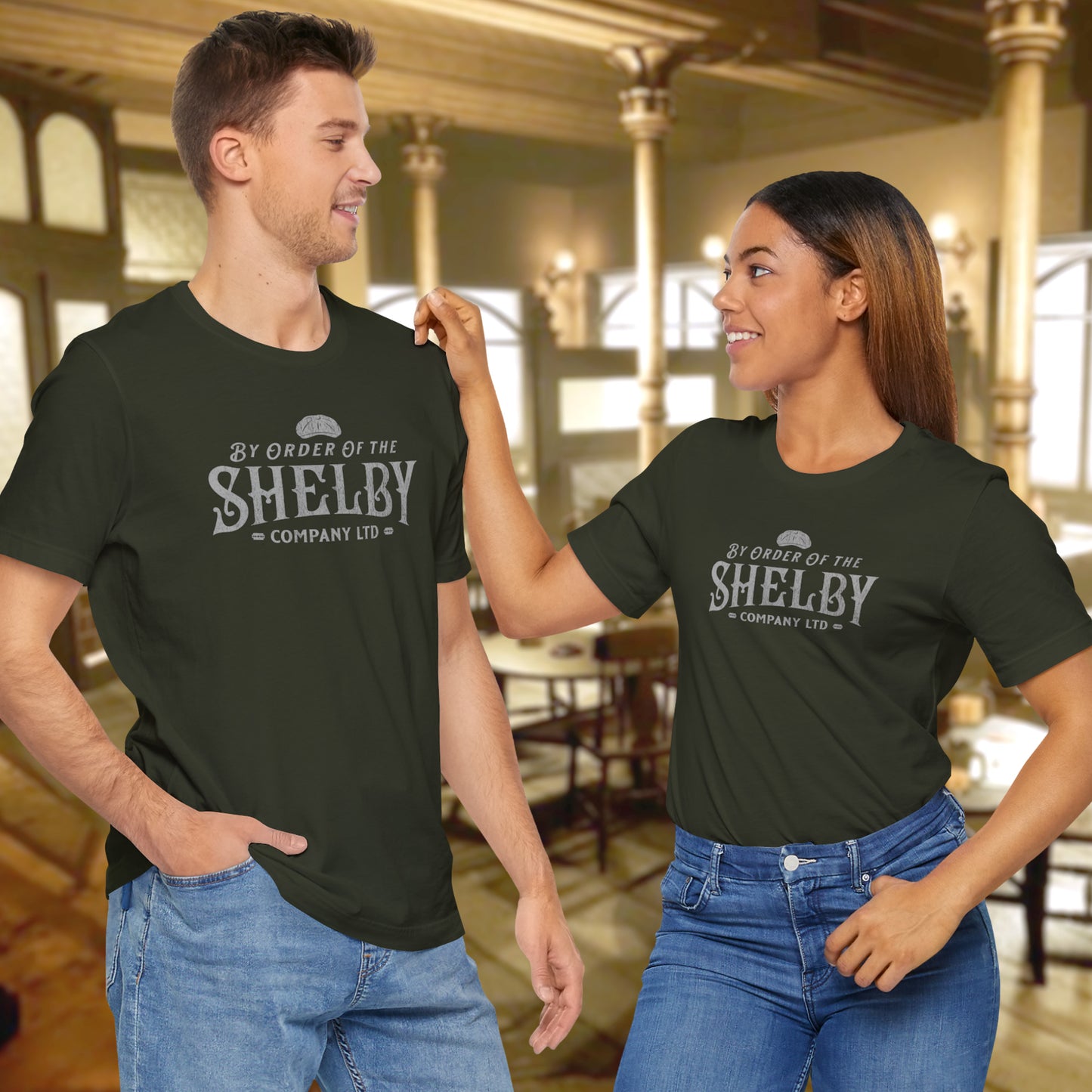 2 models wearing dark olive colored soft short-sleeve Bella+Canvas 3001 t-shirts featuring a unique Shelby Company Limited logo graphic from the show Peaky Blinders and movie The Immortal Man, in a vintage distressed style, includes a flat cap and razor blades, designed and sold by ScriptedBrand.