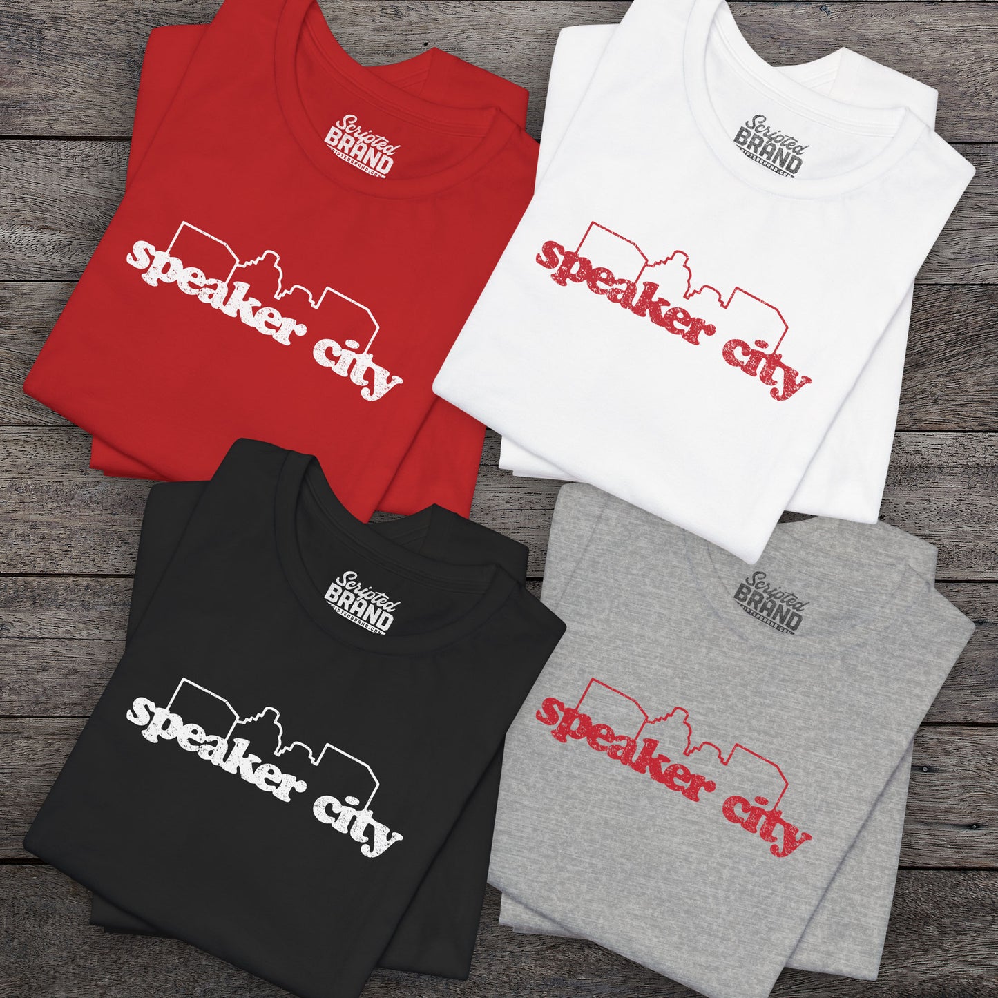 4 t-shirts featuring the Speaker City logo from the movie Old School in a vintage distressed style with white print and skyline outline.