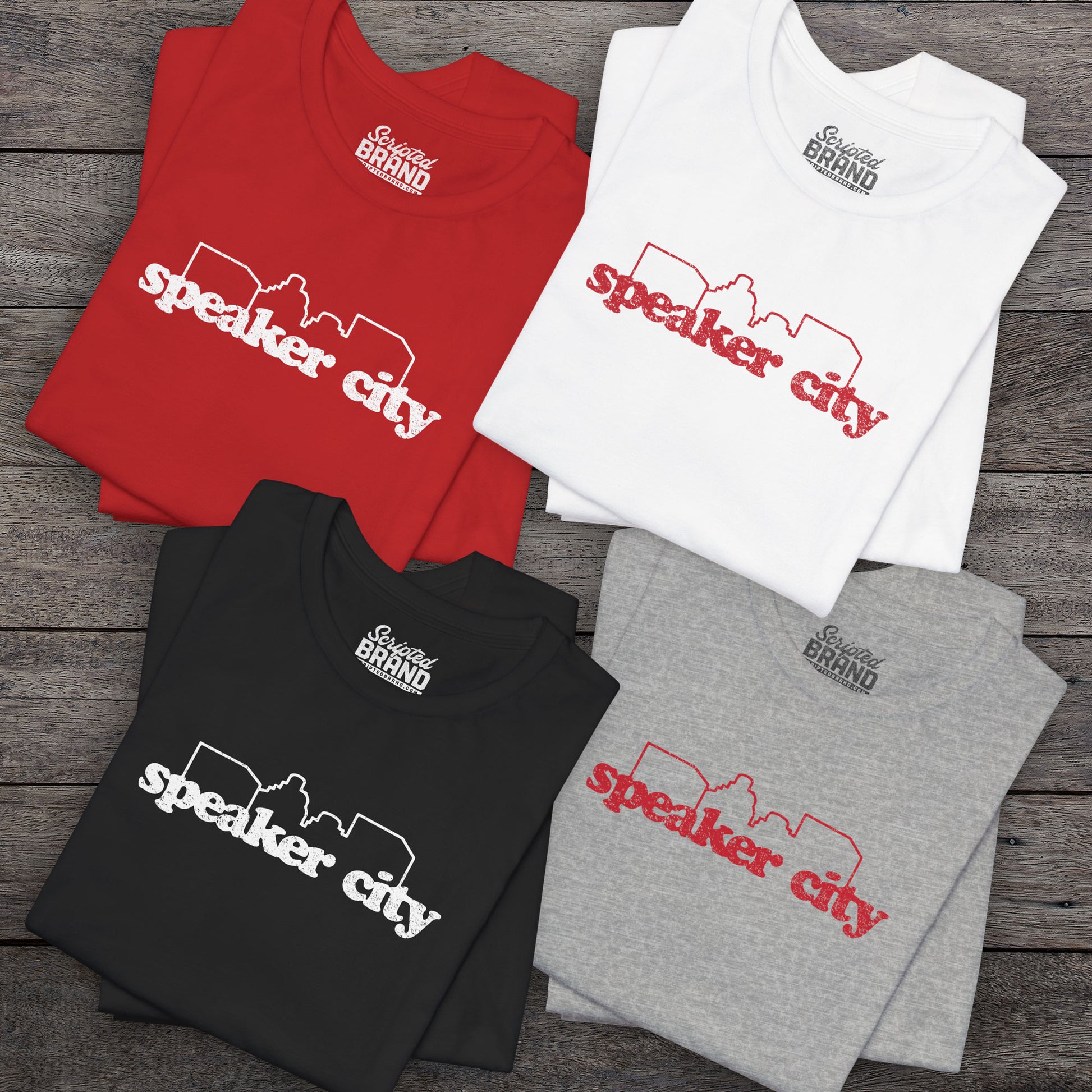 4 t-shirts featuring the Speaker City logo from the movie Old School in a vintage distressed style with white print and skyline outline.