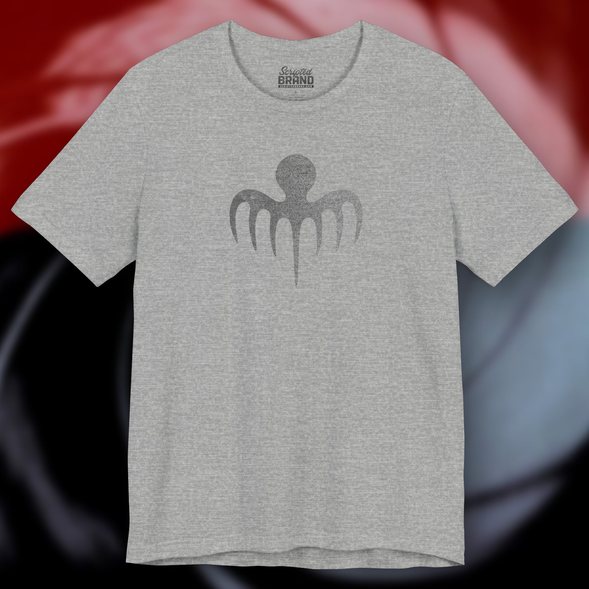 Front view of an athletic heather grey colored soft Bella+Canvas 3001 short-sleeve t-shirt featuring a logo graphic of the fictional criminal organization Spectre, inspired by the James Bond movie franchise, in a vintage distressed style.