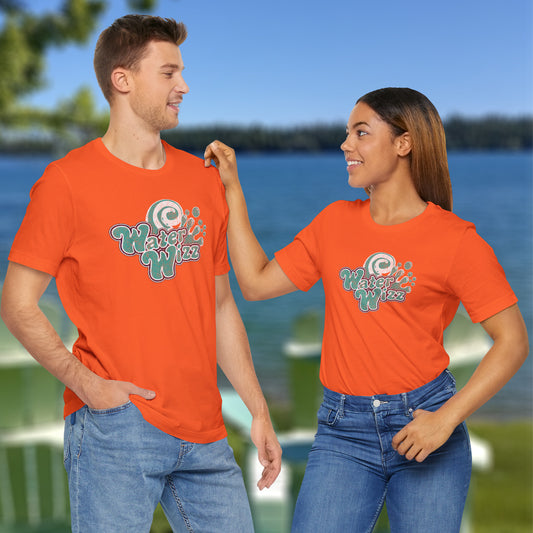 2 models wearing orange Soft short-sleeve t-shirts featuring the Water Wizz logo graphic from the movie Grown Ups in a vintage distressed style.