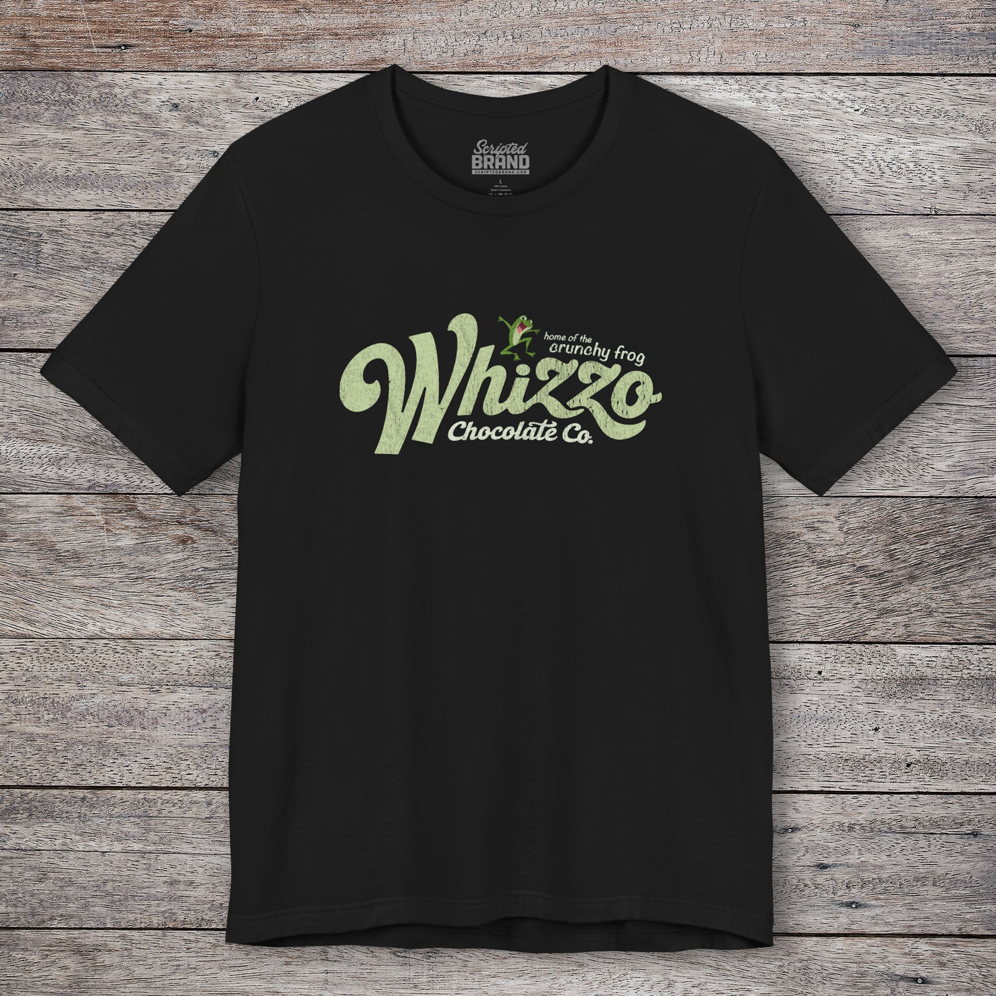 Black t-shirt with vintage Whizzo Chocolate Co. logo, inspired by Monty Python, featuring “home of the crunchy frog” graphic.