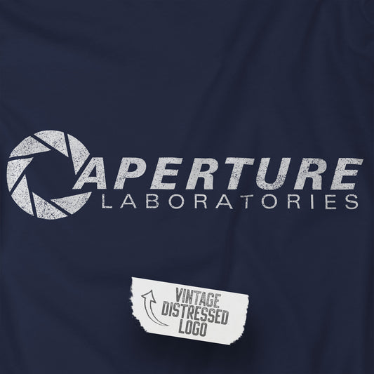 Closeup view of a navy blue colored soft long-sleeve t-shirt featuring the Aperture Laboratories logo from the video game Portal and Portal 2 in a vintage distressed style, sold by ScriptedBrand. 