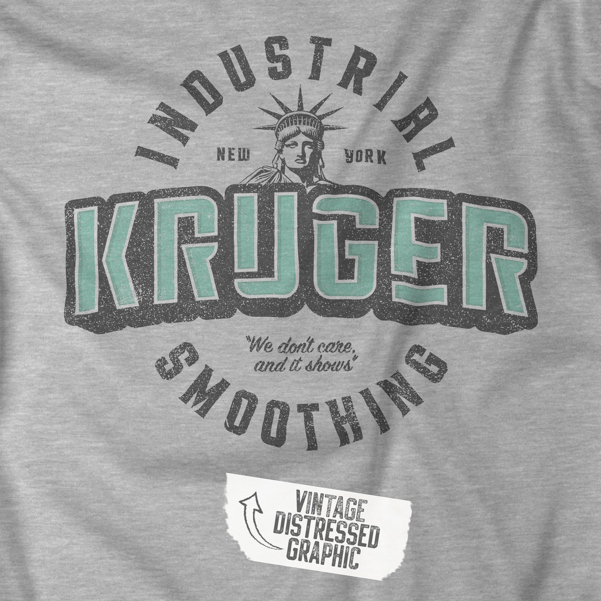 Closeup view of a grey athletic heather colored soft unisex Bella+Canvas 3501 long-sleeve t-shirt featuring a Kruger Industrial Smoothing logo graphic, designed by ScriptedBrand in a vintage distressed style, and  inspired by the TV show Seinfeld. Includes the Statue of Liberty and the the slogan "We don't care and it shows".
