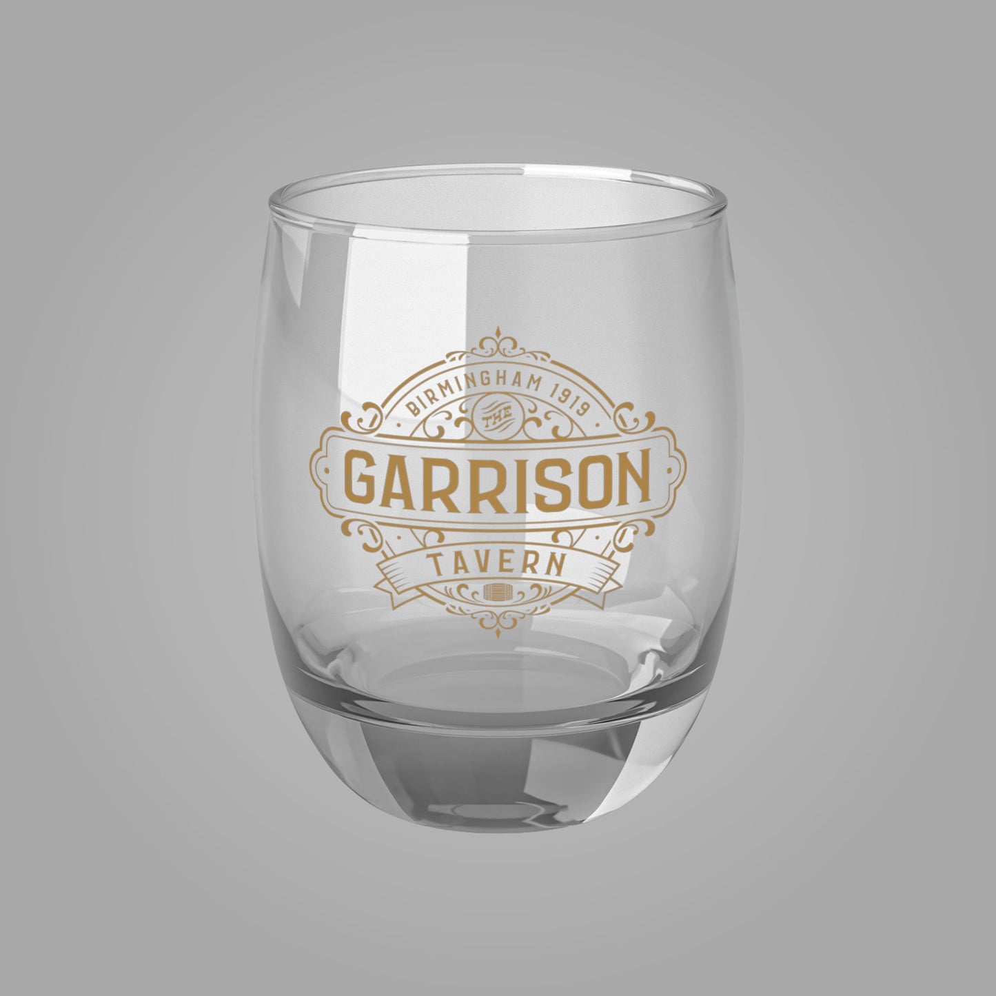 Front view of a 6 oz Whiskey Glass with the Garrison Tavern Bar Logo from the TV show Peaky Blinders