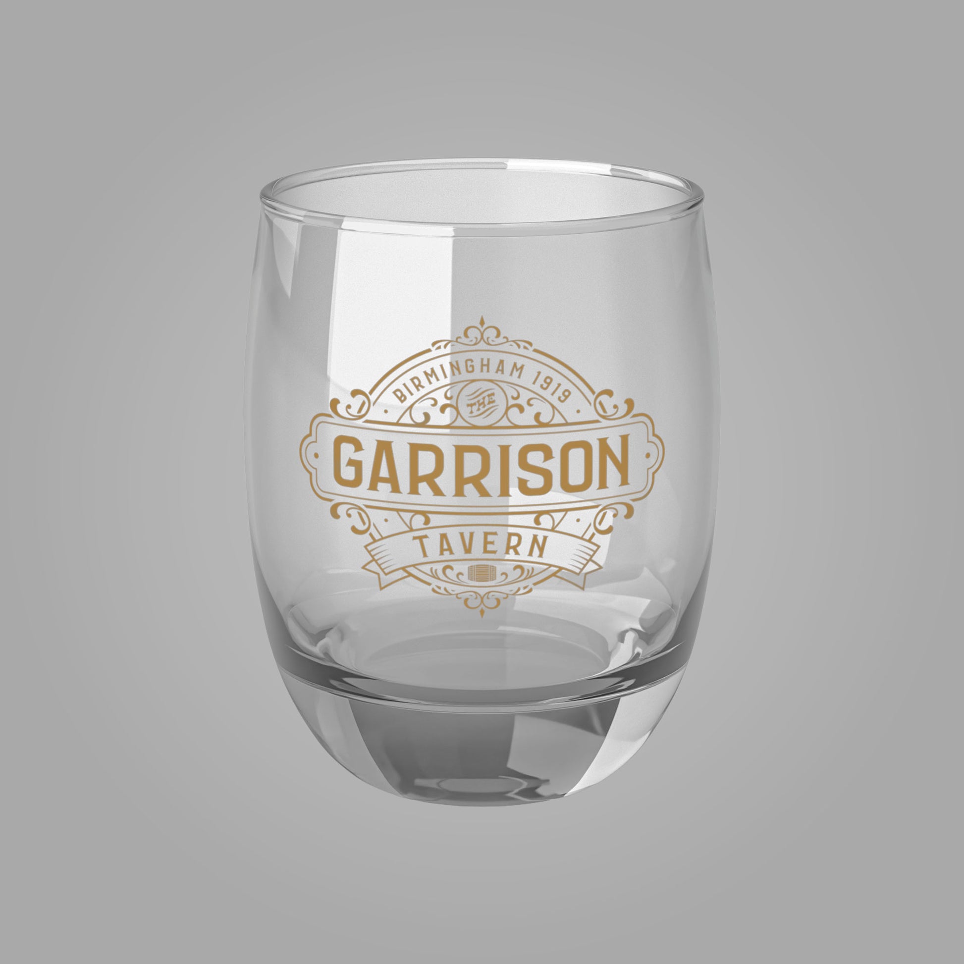 Front view of a 6 oz Whiskey Glass with the Garrison Tavern Bar Logo from the TV show Peaky Blinders
