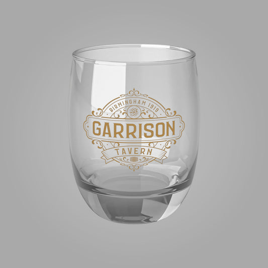 Front view of a 6 oz Whiskey Glass with the Garrison Tavern Bar Logo from the TV show Peaky Blinders
