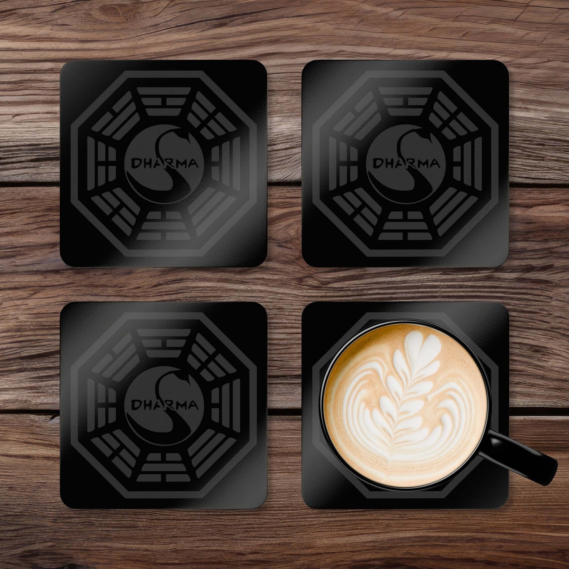 Topdown view of grid of 4 Corkwood Coasters featuring the Dharma Initiative Swan Station logo graphic from the TV show LOST.