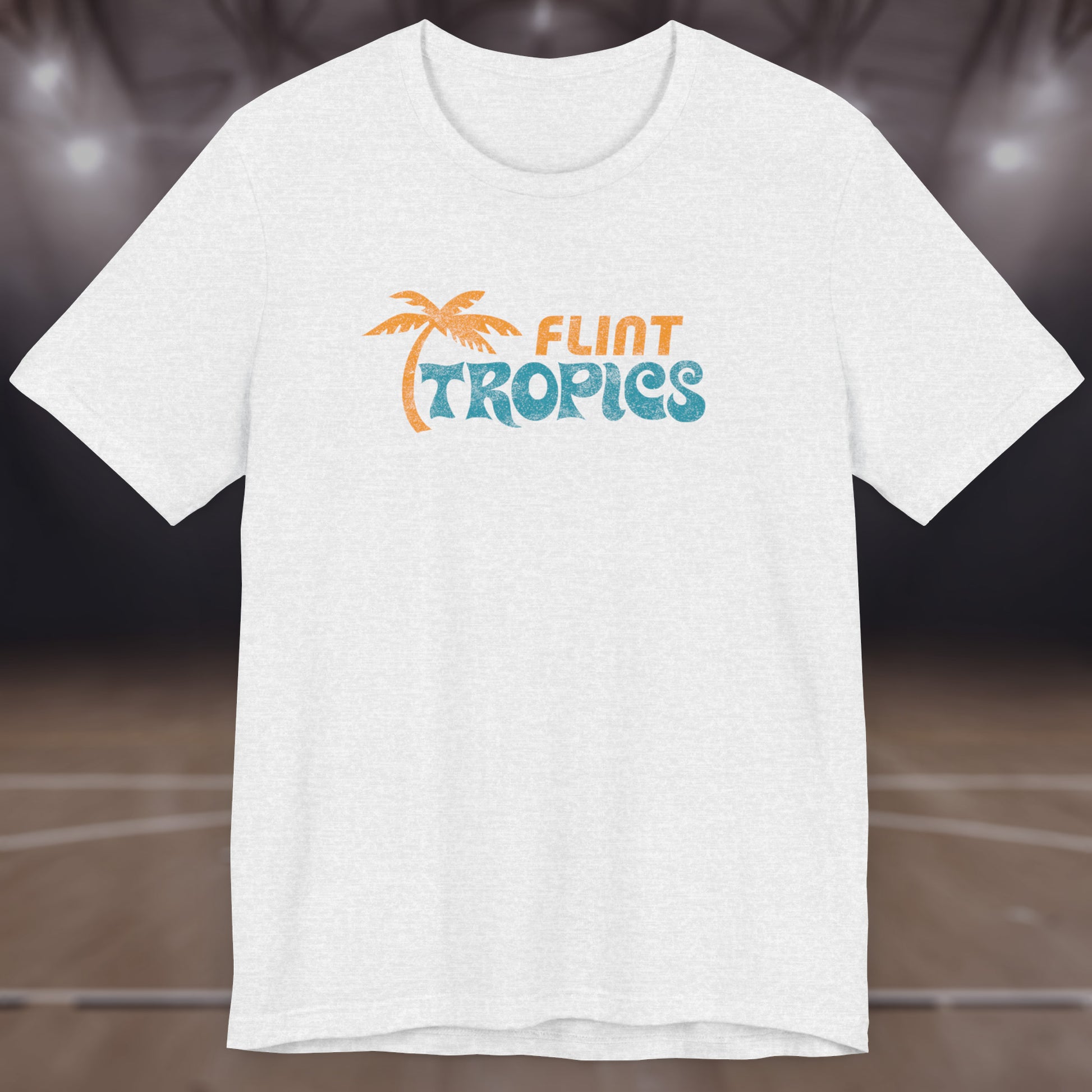 Front view of an ash colored soft Bella+Canvas 3001 short-sleeve t-shirt tee featuring the Flint Tropics logo from the movie Semi-Pro, in a vintage distressed style, sold by ScriptedBrand.