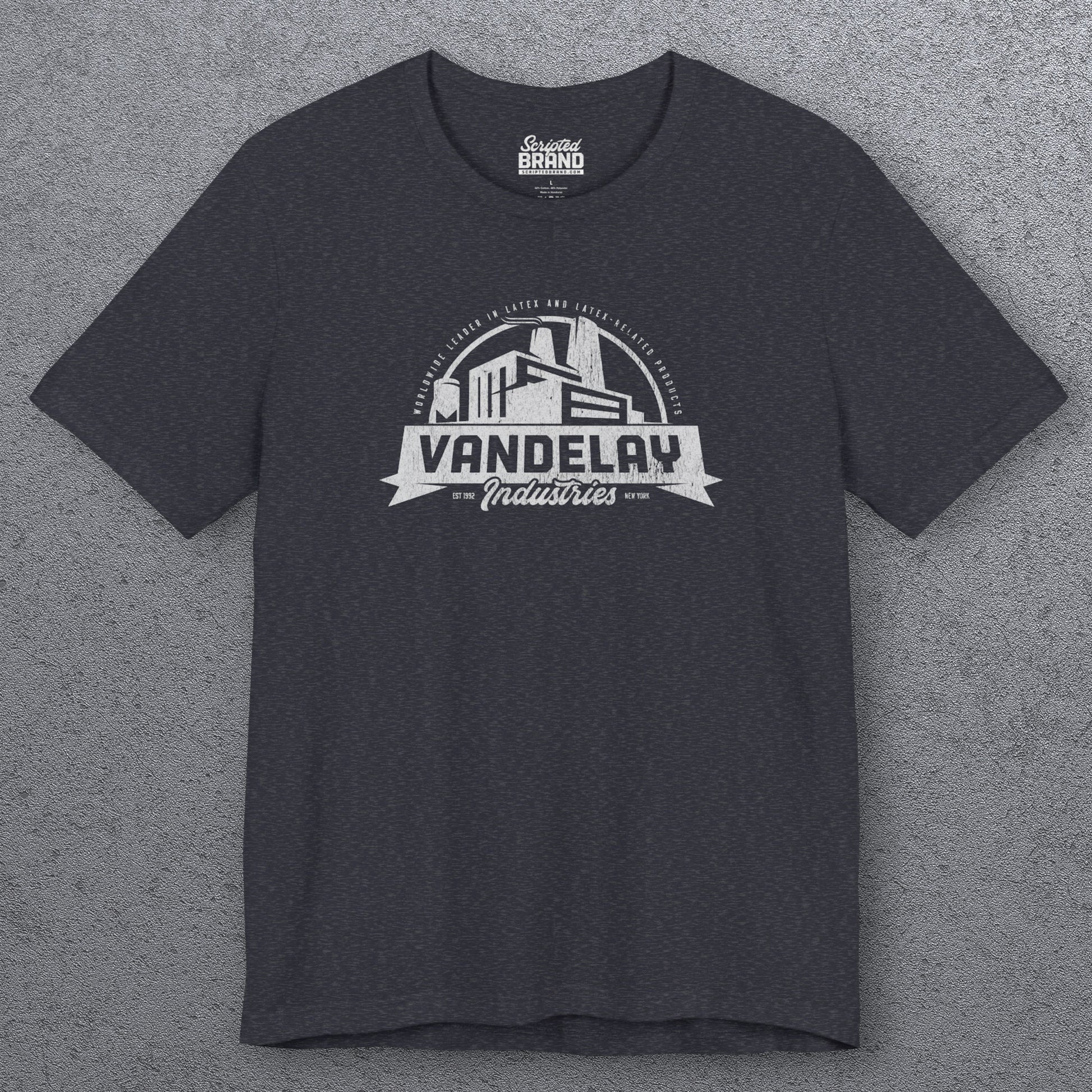 Front view of a heather navy Soft Bella+Canvas 3001 short-sleeve t-shirt tee featuring a Vandelay Industries logo graphic, uniquely designed by ScriptedBrand in a vintage distressed style. The fictional company is part of the George Costanza storyline in the TV show Seinfeld. 