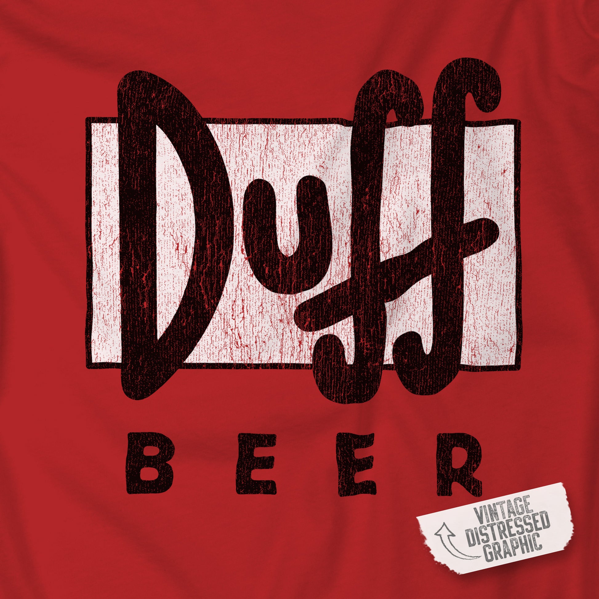 Closeup of red t-shirt featuring the Duff Beer logo from the TV Show The Simpsons in vintage distressed style.