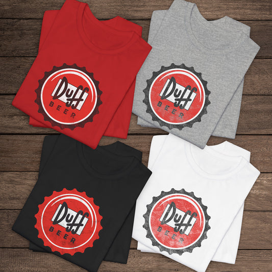 Four folded t-shirts featuring the Duff Beer bottle cap logo from the TV Show The Simpsons in vintage distressed style.