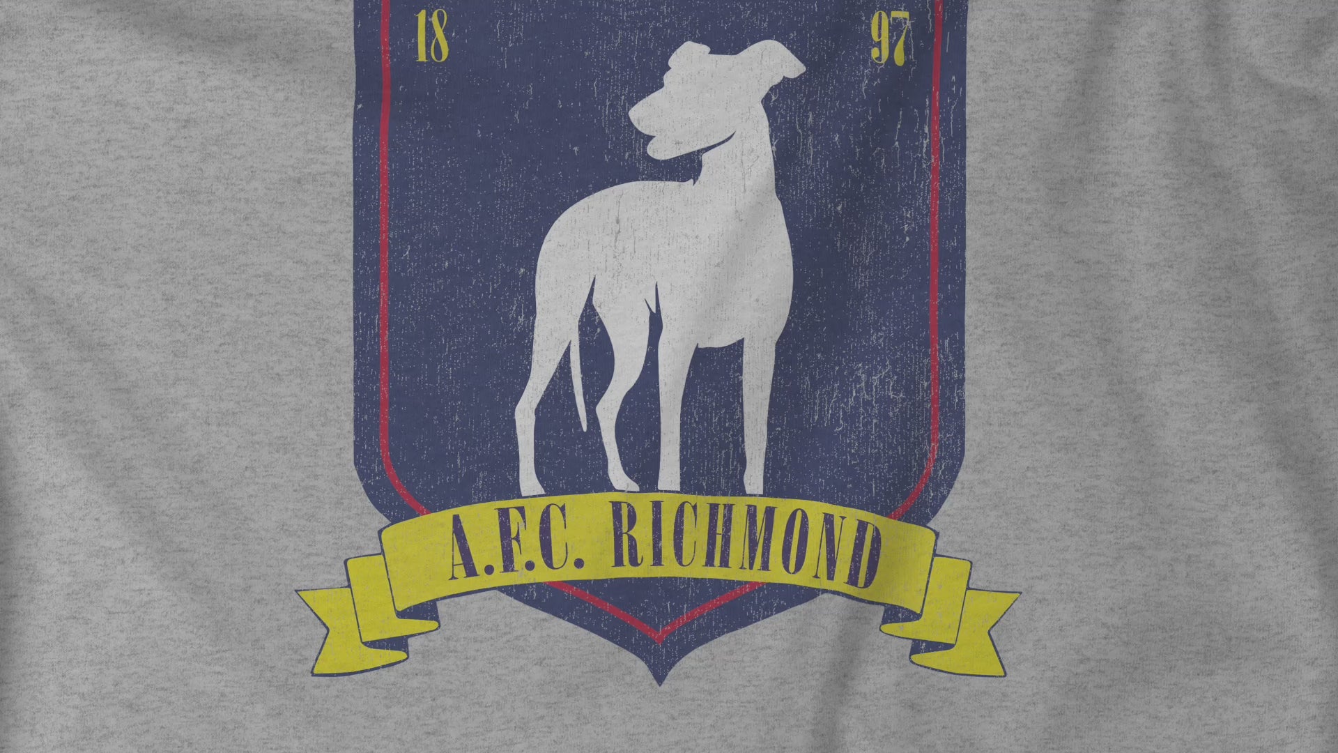 Video Closeup of an athletic heather grey soft Bella+Canvas 3001 short-sleeve t-shirt featuring the logo graphic of the fictional English soccer team AFC Richmond inspired by the TV show Ted Lasso in a vintage distressed style, sold by ScriptedBrand.