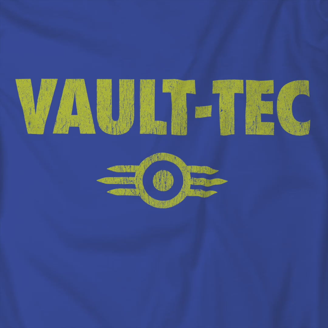 Video of t-shirt featuring the Vault-Tec logo graphic from the video game Fallout in a vintage distressed style. 