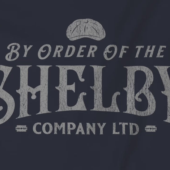 Video of Shelby Company Ltd long-sleeve tee with vintage logo from Peaky Blinders, featuring flat cap and razor blades.