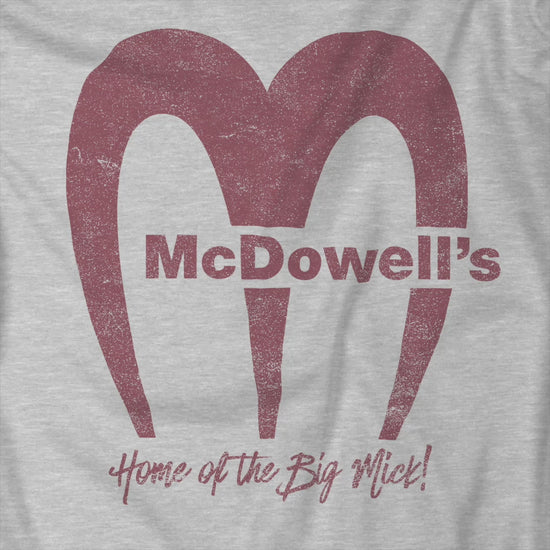 Video of t-shirt featuring the McDowells logo from the movie Coming to America in a vintage distressed style.