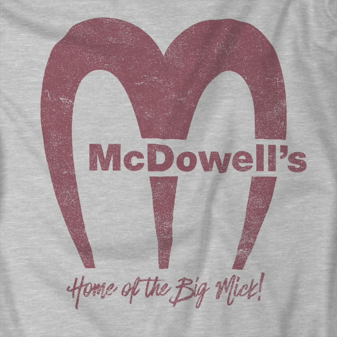 Video of t-shirt featuring the McDowells logo from the movie Coming to America in a vintage distressed style.