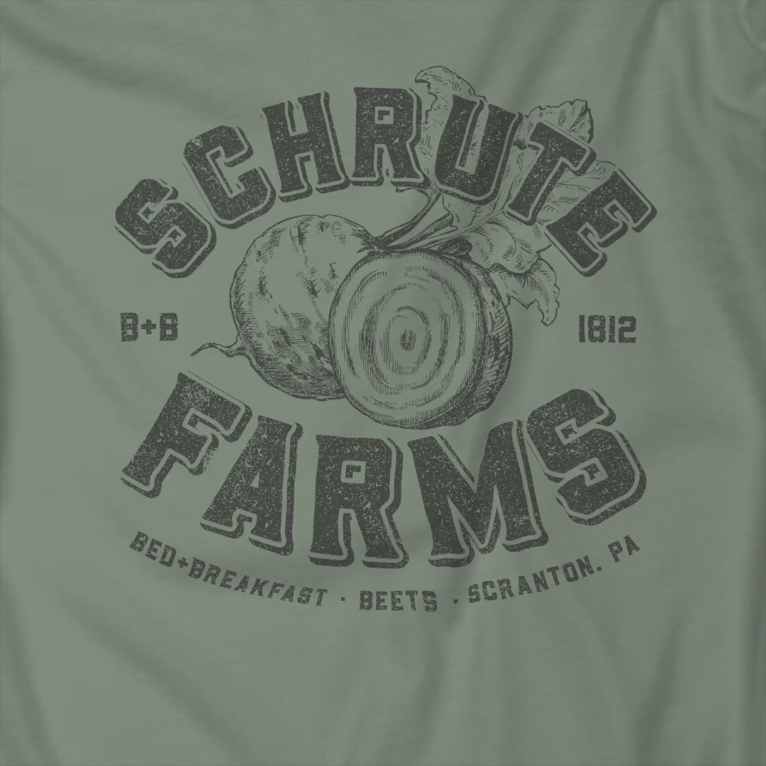 Video of t-shirt featuring a Schrute Farms logo from the TV show The Office designed by ScriptedBrand in a vintage distressed style.