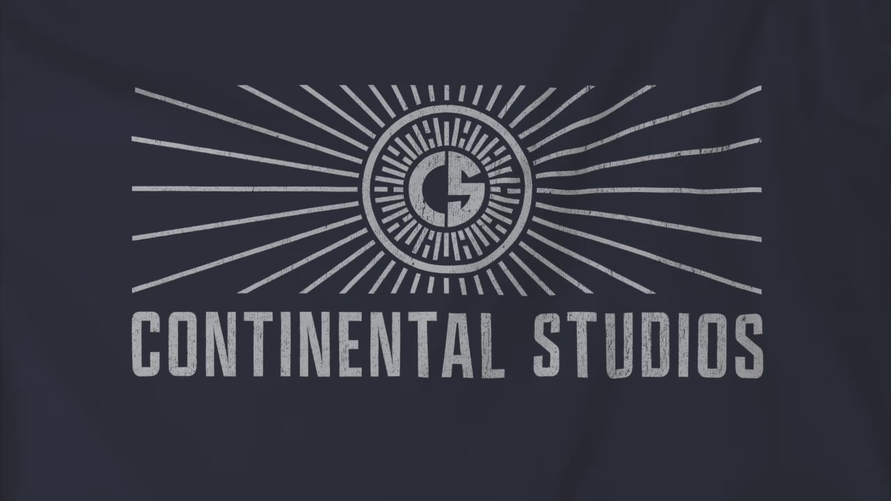 Video closeup of Soft Bella+Canvas 3001 short-sleeve t-shirt featuring the logo graphic of the fictional movie studio Continental Studios inspired by the Apple TV show The Studio in a vintage distressed style, sold by ScriptedBrand.