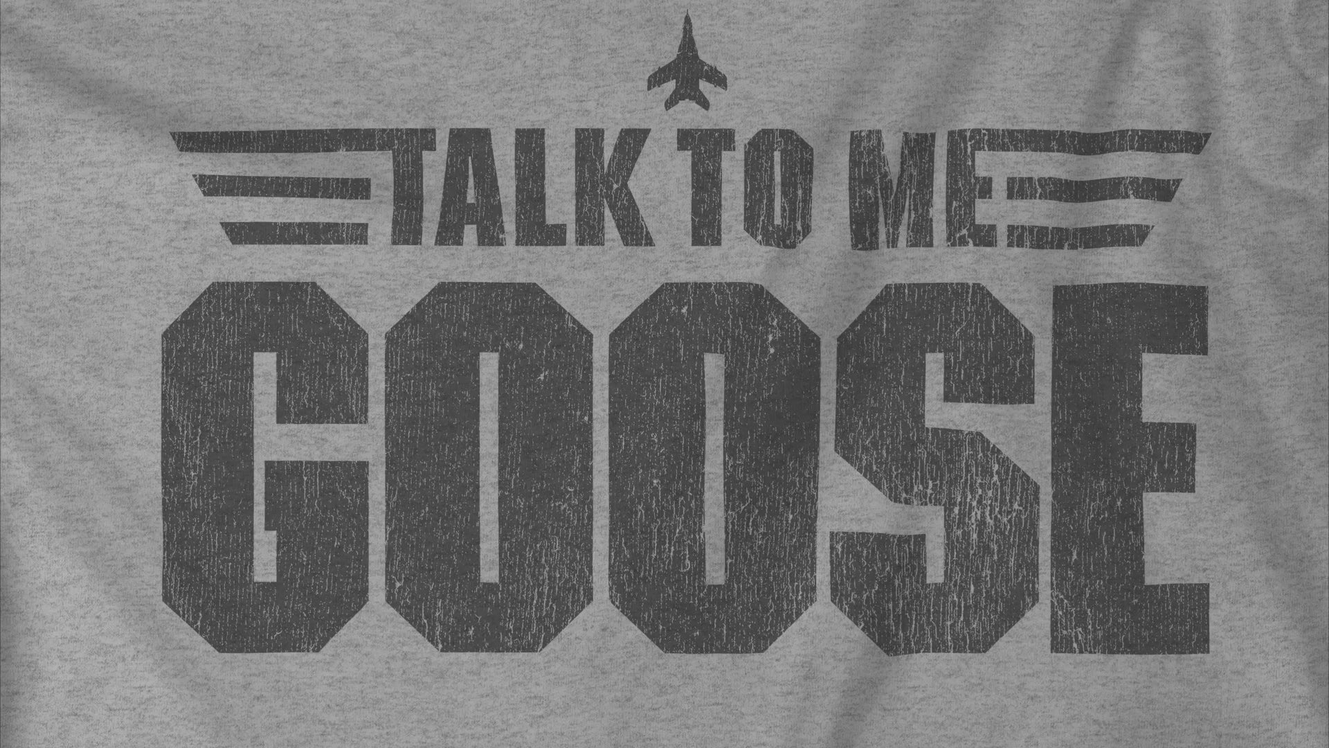 Closeup video of distressed graphic “Talk to Me Goose”, inspired by the movie Top Gun, made by ScriptedBrand.