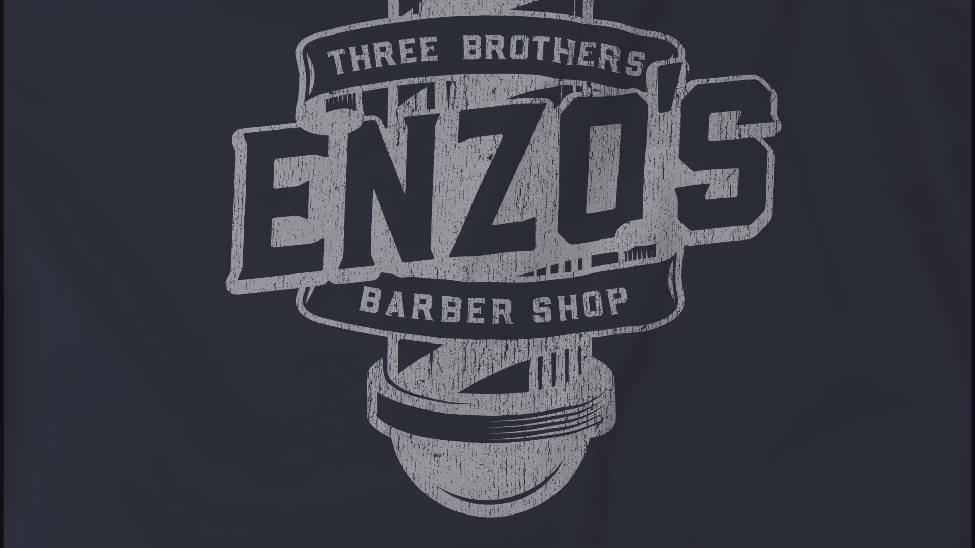 Video closeup of soft unisex Bella+Canvas 3001 short-sleeve t-shirts featuring a unique Enzo's Barber Shop logo graphic, designed by ScriptedBrand in a vintage distressed style, and inspired by the TV show Seinfeld.