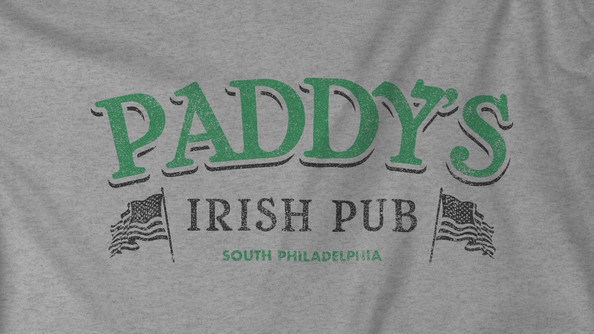 Video closeup of soft unisex Hoodie Heavy Blend Hooded Sweatshirts featuring the green Paddy's Pub logo graphic from the TV Show It's Always Sunny in Philadelphia, in a vintage distressed style, sold by ScriptedBrand.