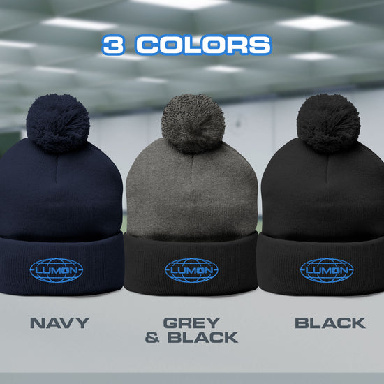 Video featuring a Pom-Pom Winter Knit Hat featuring the embroidered logo of Lumon Industries from the Apple TV Show Severance.