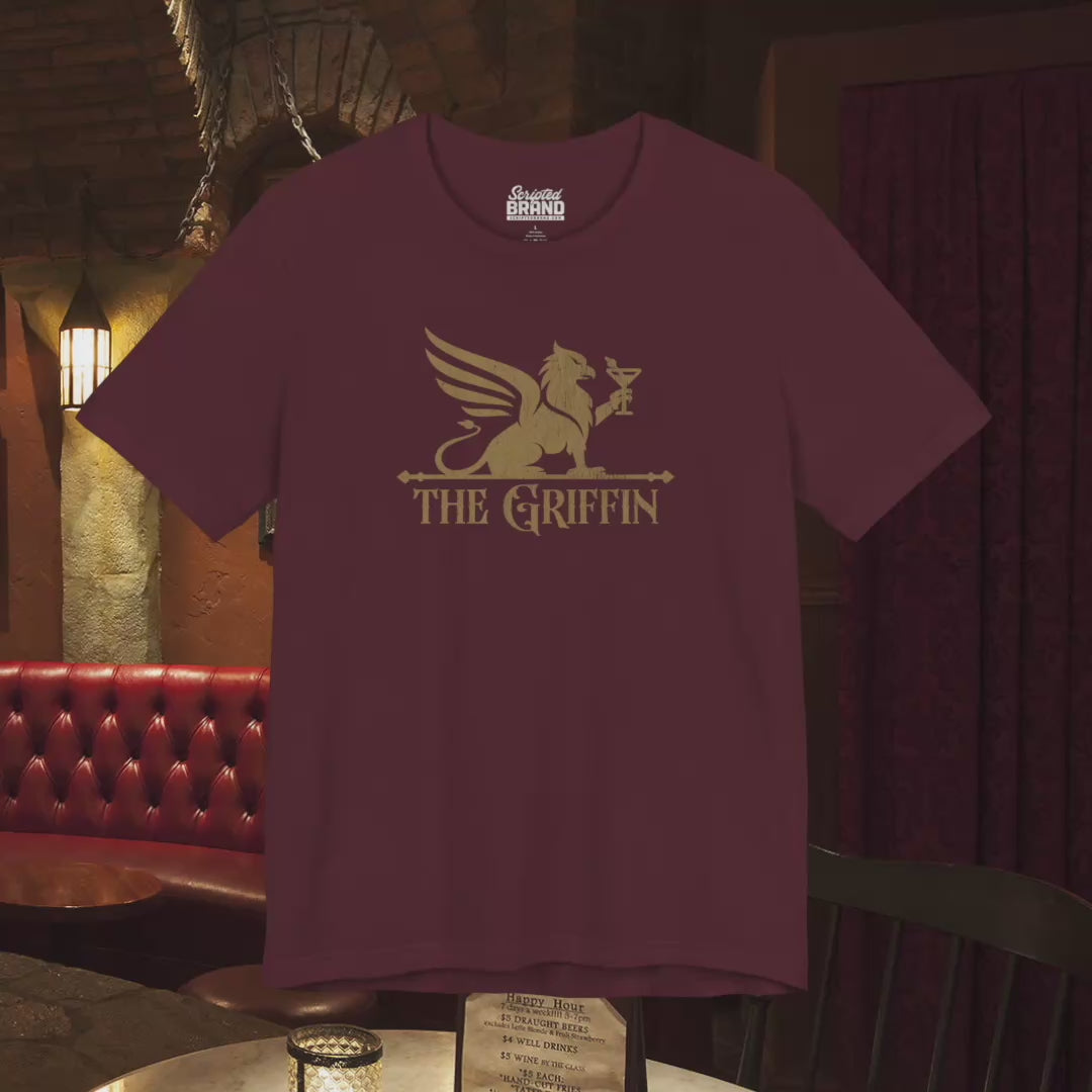 Video of t-shirts featuring gold 'The Griffin' Bar logo inspired by the TV show New Girl in a vintage distressed style.