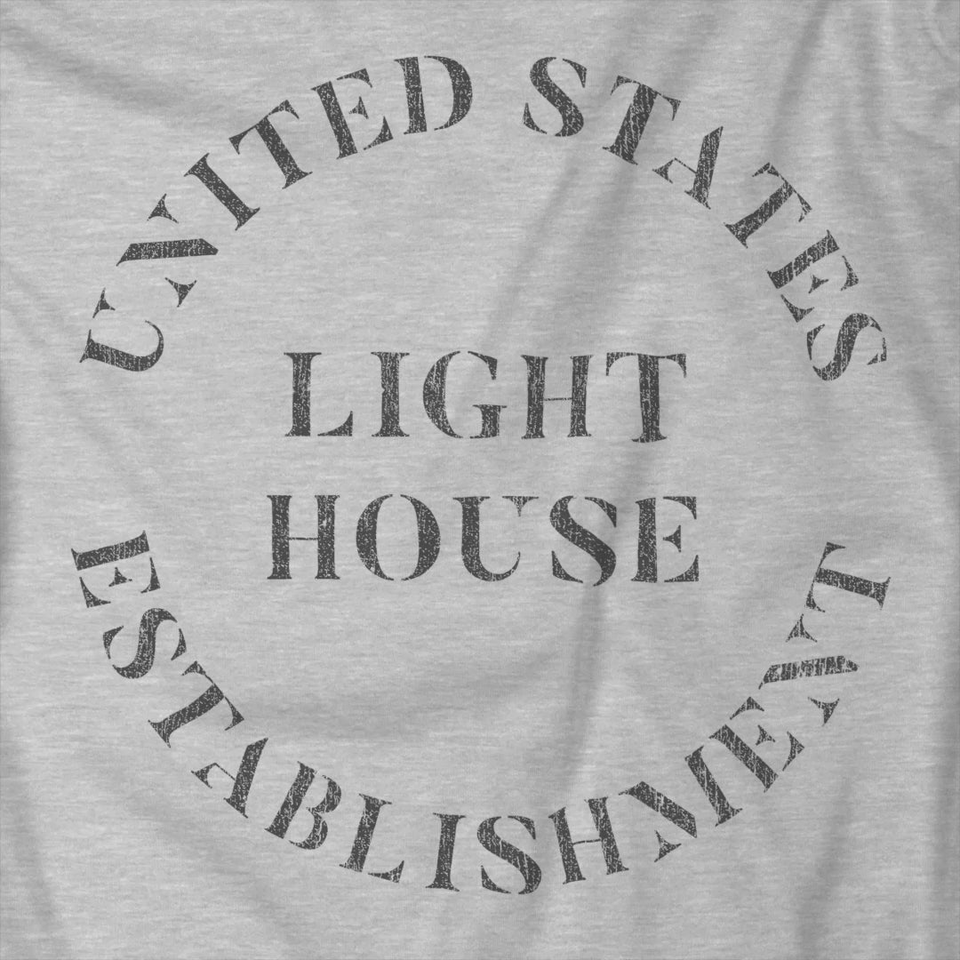 Video of t-shirt featuring the United States Light House Establishment logo graphic worn by Robert Pattinson in the movie The Lighthouse in a vintage distressed style.