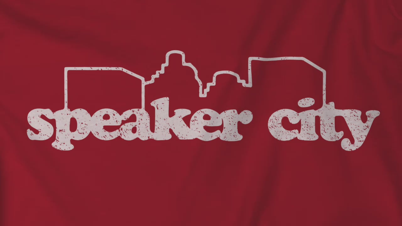 Video of t-shirts featuring the Speaker City logo from the movie Old School in a vintage distressed style and skyline outline.