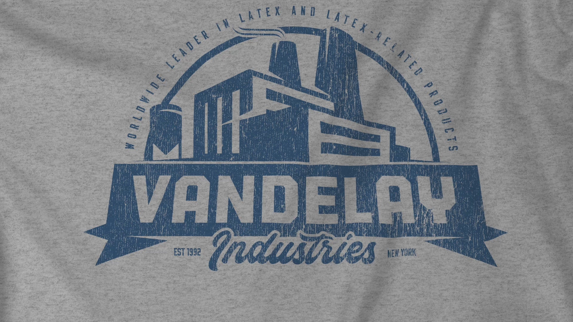 Video closeup of soft Bella+Canvas 3001 short-sleeve t-shirts featuring a Vandelay Industries logo graphic, uniquely designed by ScriptedBrand in a vintage distressed style. The fictional company is part of the George Costanza storyline in the TV show Seinfeld. 