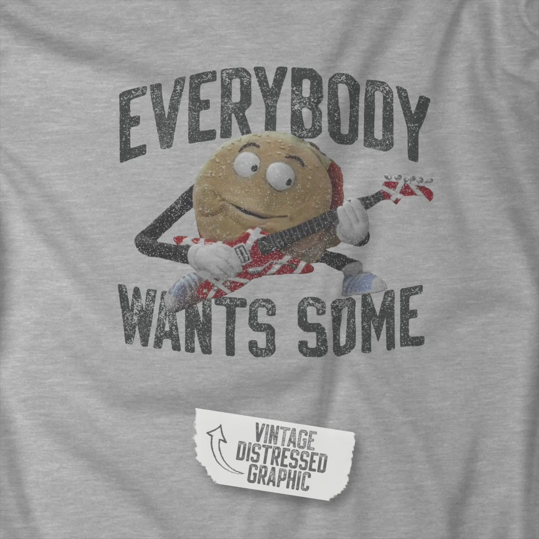 Video of t-shirt with the phrase EVERYBODY WANTS SOME and a graphic of the guitar playing hamburger from the movie Better Off Dead in a vintage style.